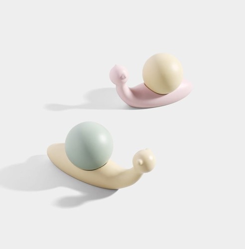 KinderMöbelgriff Caracol in Schneckenform. Pastellrosa oder Pastellgrün schmückt Schränke, Kommoden und Schubladen im Kinderzimmer und verbindet praktische Funktion mit kreativer, moderner Dekoration.