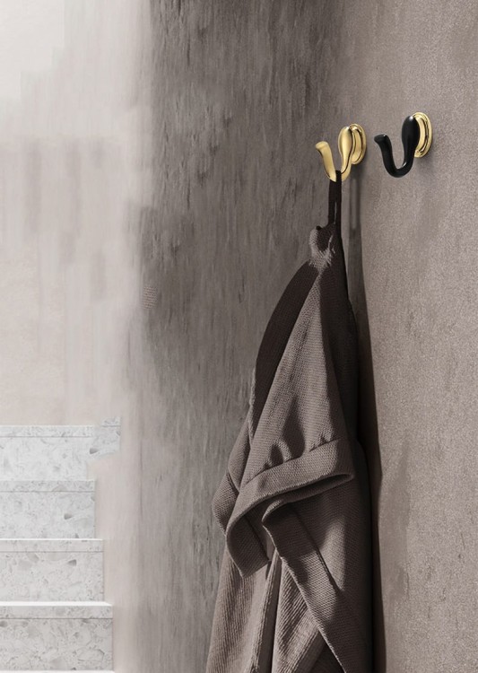 Wandhaken Tunas mit designerischer, geschwungener Form. Robust, feuchtigkeitsbeständig und leicht zu montieren, Schrauben im Set. Ideal für Bad, Küche, Garderobe und Büro. Farben: Metallicgrau, Gold und Schwarz-Gold.