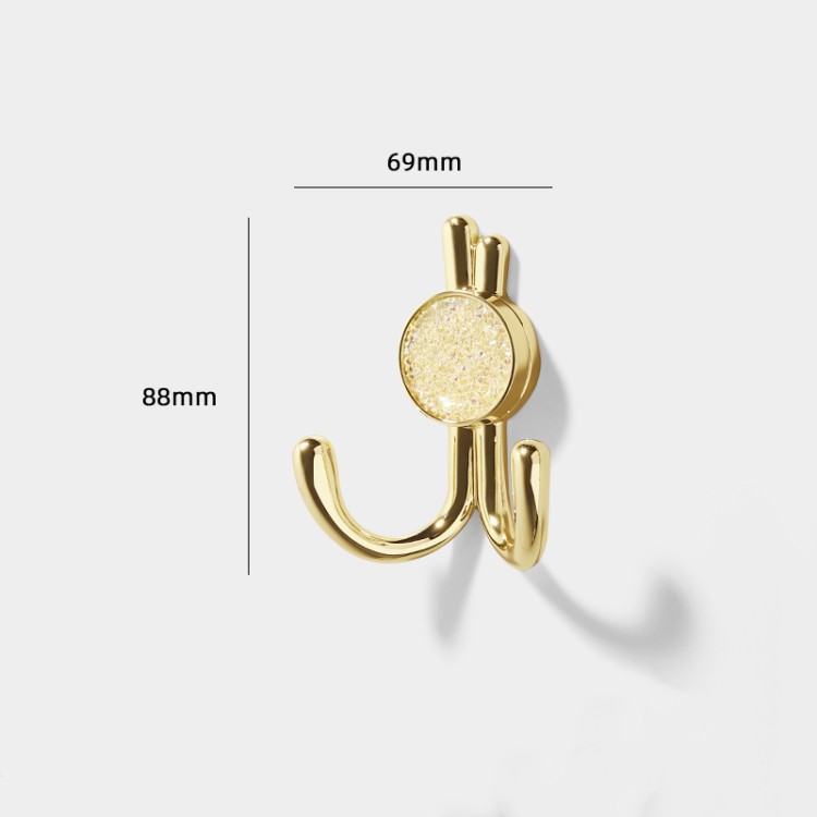 Wandhaken Rosa mit Doppelhaken und dekorativen diamantartigen Enden. Elegant, feuchtigkeitsbeständig, in vielen Gold-, Schwarz-, Silber- und Grautönen erhältlich – für Zuhause und gewerbliche Innenräume.