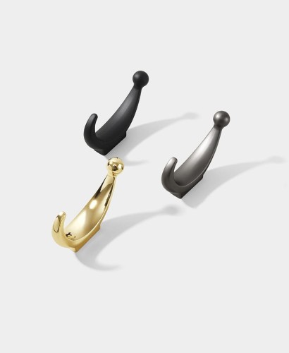 Wandhaken Celma – schlichtes, elegantes Design in moderner Ausführung. Solide verarbeitet, leicht zu montieren und vielseitig einsetzbar in Bad, Küche, Flur oder Büro. Farben: Gold, Schwarz und Perlgrau.