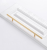 Möbelgriff Alma – schlichter zylindrischer T-Bar-Griff in Gold, Champagnergold oder Schwarz, passend für moderne und klassische Interieurs. Viele Größen für Kommoden, Schränke, Garderoben und Badmöbel.