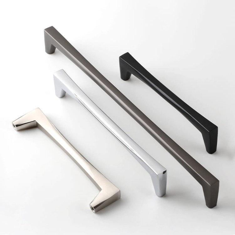 Möbelgriff Mela – moderner, klassischer und minimalistischer Griff in Schwarz, gebürstetem Gold, gebürstetem Nickel und Perlgrau. Größen 128–256 mm, ideal für Küchen- und Badmöbel, Garderoben und Kommoden.